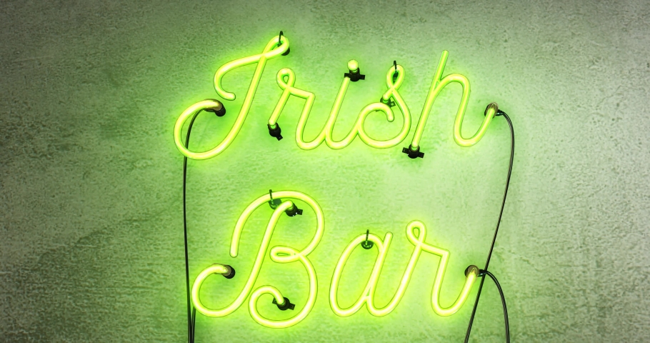Irish Bar neon sign, this realistic sign starts when the sign is off then it turns on with amazing flashing flickering effects, then after 30 seconds it flashes on and off, on a concrete grey wall. | Shutterstock HD Video #1029623987