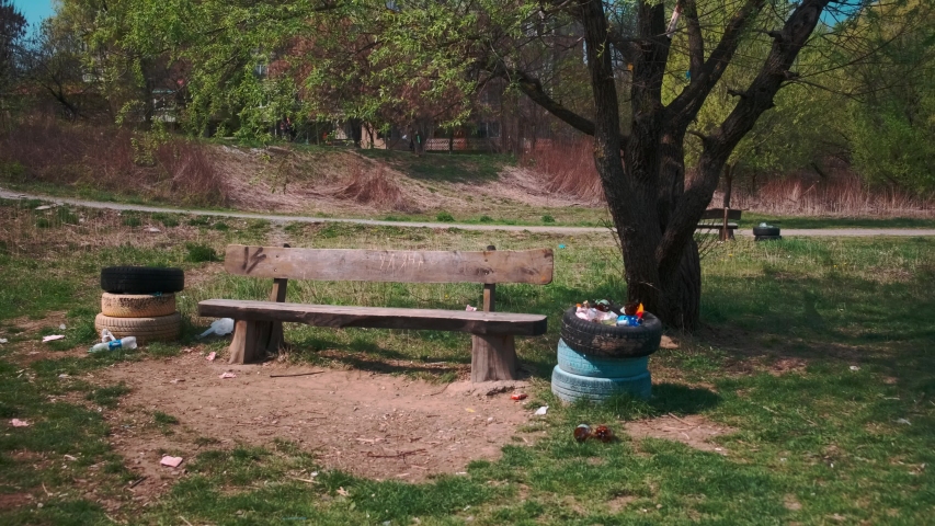A pad in the park where the garbage is scattered. 4k. 60fps