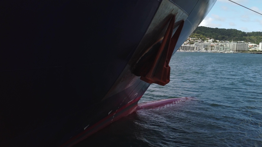 Slow motion pan across front of ship anchored in Wellington, New Zealand