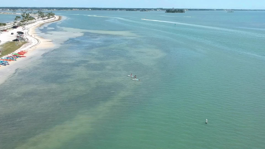 Island fun with boats, island fly overs,  paddle boarders, canoes and more. Smooth buttery shots of sun island adventures in Tampa Florida.