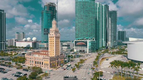 MIAMI, FLORIDA, USA - MAY 2019: Aerial drone view flight over Miami downtown. Freedom Tower and Biscayne boulevard from above at sunny day with clouds.