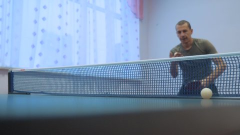 table tennis lifestyle backhand concept. slow motion video. blurred focus man playing training table tennis the sport activeの動画素材