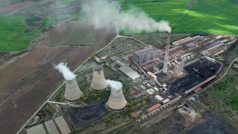 Aerial video of a power plant during sunny day