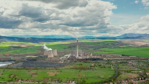 Aerial video of a power plant during sunny day