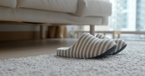 Woman wear slipper at home