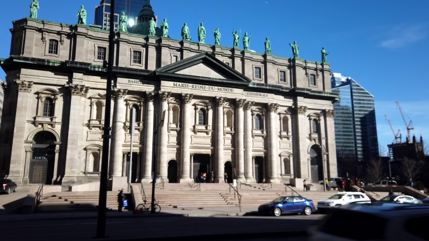 4k hyperlapse form left to right of Notre-Dame Basilica of Montreal (French: Basilique Notre-Dame de Montréal) with busy traffic