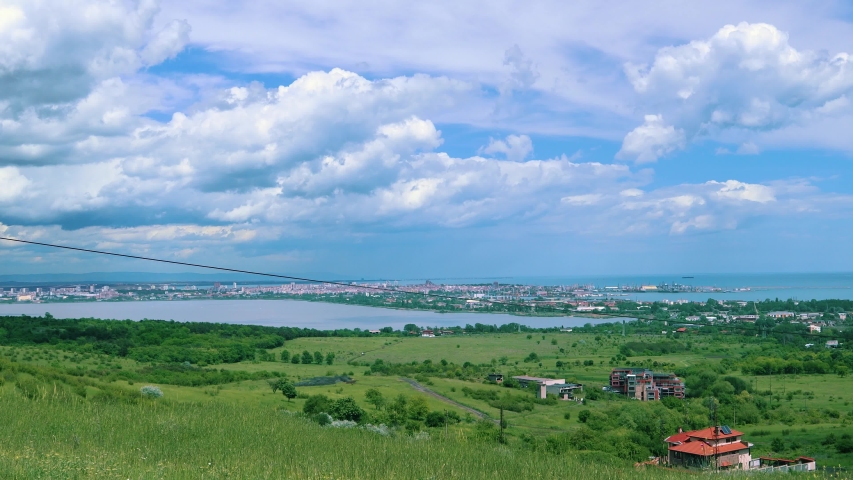 Burgas city timelapse from above Burgas Park. light clouds pass over the city. 4k