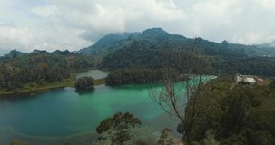 Beautiful aerial landscape footage of the Coloured Lake in Dieng Plateau, Wonosobo, Central Java, Indonesia.