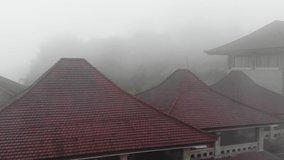 Creepy slow motion footage of the abandoned Ghost Palace Hotel in Bali, surrounded by a dense fog