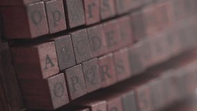 Close up view of alphabet wooden rubber stamps. Selective focus.