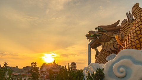 timelapse sunset at Dragon descendants museum in Suphanburi. the big golden dragon is a famous landmark in Suphanburi city 
can see from destination tourists like to visit this museum