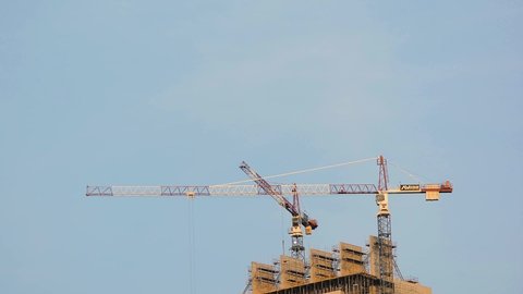 Sandton, Johannesburg, Gauteng / South Africa - 15 May 2019: Cranes moving while constructing The Leonardo development