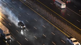 Cars driving on highway during heavy rain. Out of focus blurry bokeh video.