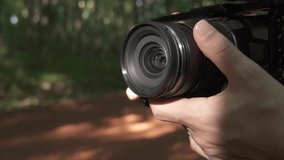 Hand Holds a Camera and Start Recording, Close Up