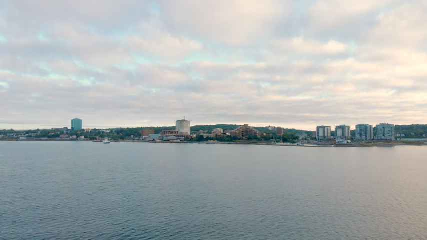 Cinematic drone / aerial footage static showing ocean waterfront in Halifax, Nova Scotia during summer season.