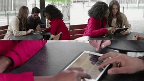 Collage of medium and close up shots of pretty Afro-american woman showing photos on tablet to good looking young couple, they swiping pictures, choosing. Wedding preparation. Communication concept