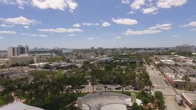 Aerial Shooting. Drone flies above the park in Miami Beach capturing city view