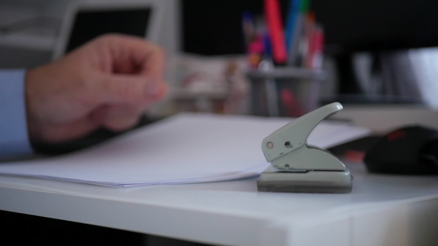 Slow Motion with Businessman Office Work Using a Drill Press for Documents
