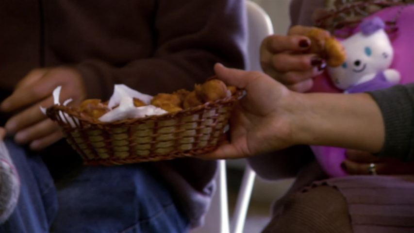 Man Serving Tray of Food at Parent–teacher Conference in a Public School in Argentina. Close Up.