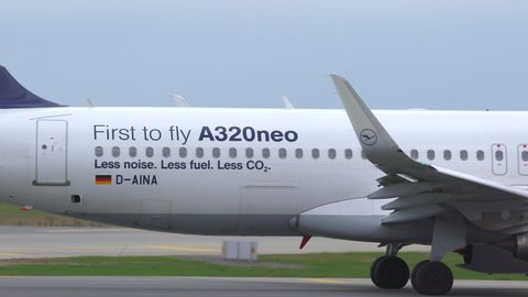 oslo airport norway - ca may 2019: airplane lufthansa text first to fly airbus a320 neo taxing panning right