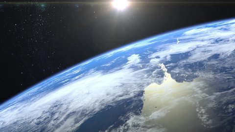 Earth from space. The camera rotates and flies away from the Earth. Stars twinkle. 4K. Sunrise. Realistic atmosphere. 3D Volumetric clouds. The sun is in the frame.