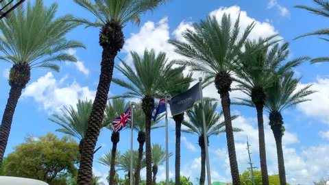 George Town, Grand Cayman, Cayman Island, April 25, 2019: Three beautiful flags blowing in the wind in a beautiful day in George Town. 