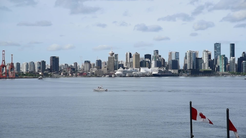 The season for cruises in Alaska is back, and so they are also back in Vancouver.   A boat is making its way across the inlet.