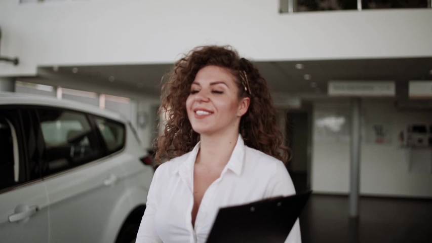 Buying a car at a car dealership | Shutterstock HD Video #1029816692