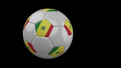 Soccer ball with flag Senegal flies past camera, slow motion blur, 4k footage with alpha channel