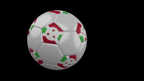 Soccer ball with flag Burundi flies past camera, slow motion blur, 4k footage with alpha channel