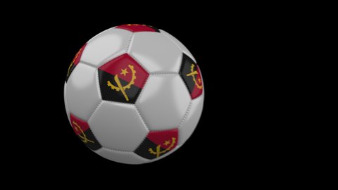 Soccer ball with flag Angola flies past camera, slow motion blur, 4k footage with alpha channel