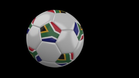 Soccer ball with flag South Africa flies past camera, slow motion blur, 4k footage with alpha channel