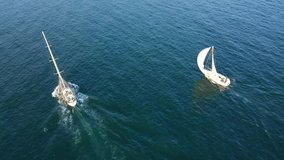 Aerial drone birds eye view video of sail boats cruising the Ionian sea, Greece