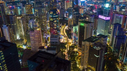 night time illuminated kuala lumpur city center traffic street aerial panorama 4k timelapse malaysia