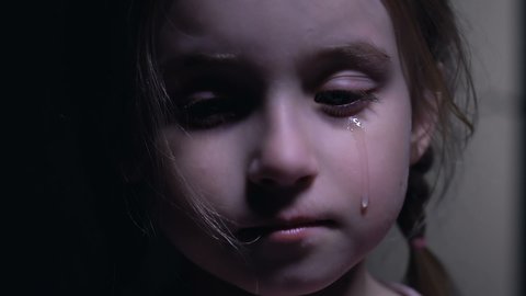 Beautiful little girl crying, defenseless victim of kidnapping, child abuse