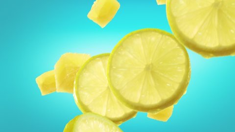 Lemon with Slices Falling on Ice Blue Background. Loopable