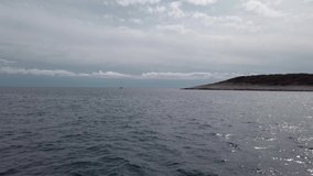 Lighthouse Pokonji Dol, near island Hvar, view from the boat, 4K Video
