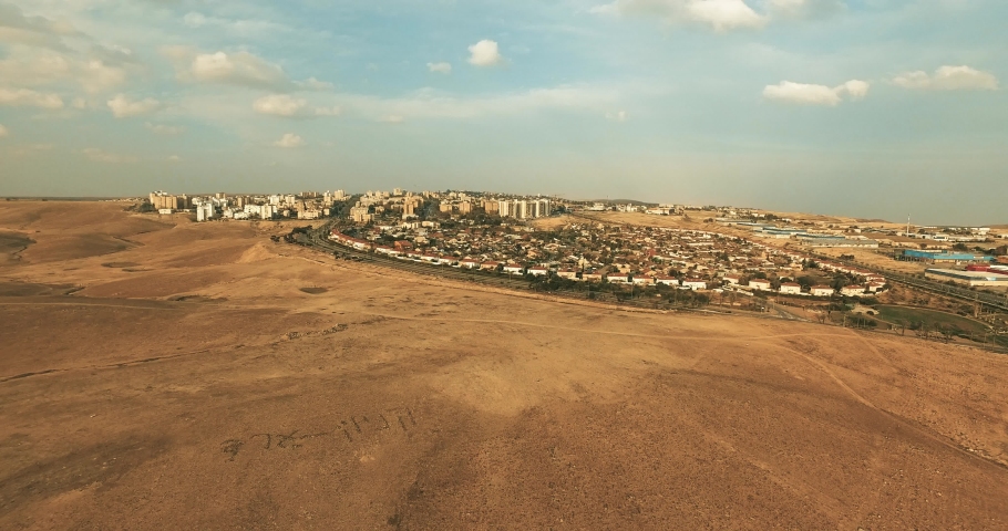 Modern Town by the Desert with Blue Sky