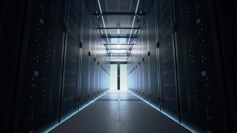 Camera slowly moving along the narrow corridor in data center with server equipment on both sides, the lights gradually turning off until total darkness. Photorealistic 3D render animation.