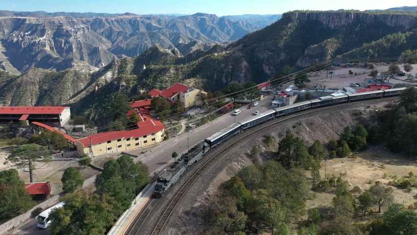 Aerial drone view over the Chepe Train moving at the station of Divisadero in Copper Canyon, Chihuahua, Mexico