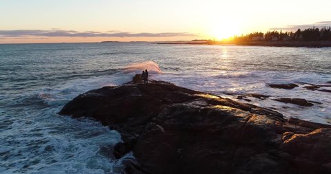Couple enjoying the sunset in Curtis island lighthouse Camden Maine USA