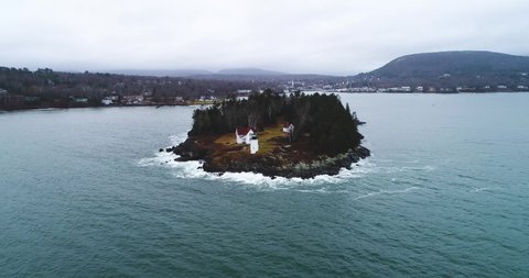 Zooming aerial shot of Curtis island lighthouse Camden Maine USA