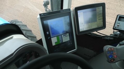 UKRAINE, CHERKASY, MAY 6, 2019: close-up, special computers were installed in the tractor driver's cab, monitors to create all the conditions for high-quality sowing of corn and sunflower. one can see