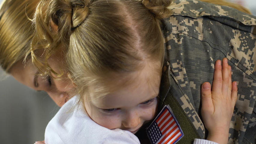 Cute girl hugging female soldier closeup, child missing mother family separation
