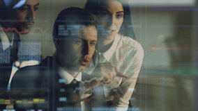 The three business people working with a hologram on the virtual screen - Powered by Shutterstock - Get 15% off with code: PIKWIZARD15