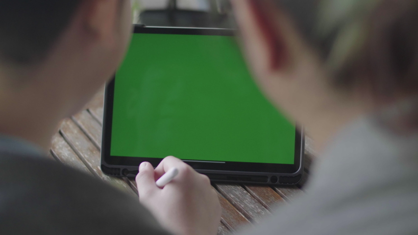 Mother and Son using digital tablet together, Green screen chroma key. Royalty-Free Stock Footage #1029915542