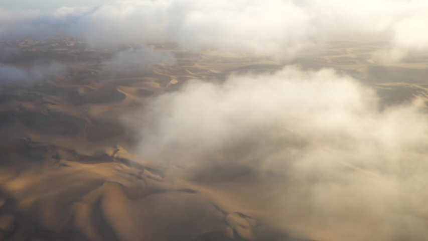 Wide Epic shot of Namibian Sossuvlei from a Small Airplane, with Nice Shadows and Small Clouds | Shutterstock HD Video #1029917222