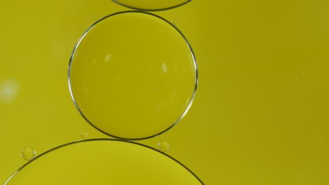 Bubble oil on water background Yellow color