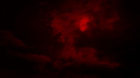 Clouds Move Over A Red Moon