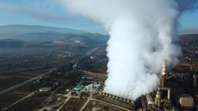 Aerial footage of nuclear power plant or nuclear power station a thermal power station in which the heat source is a nuclear reactor this plant is located in a heavy industrial zone 4k quality